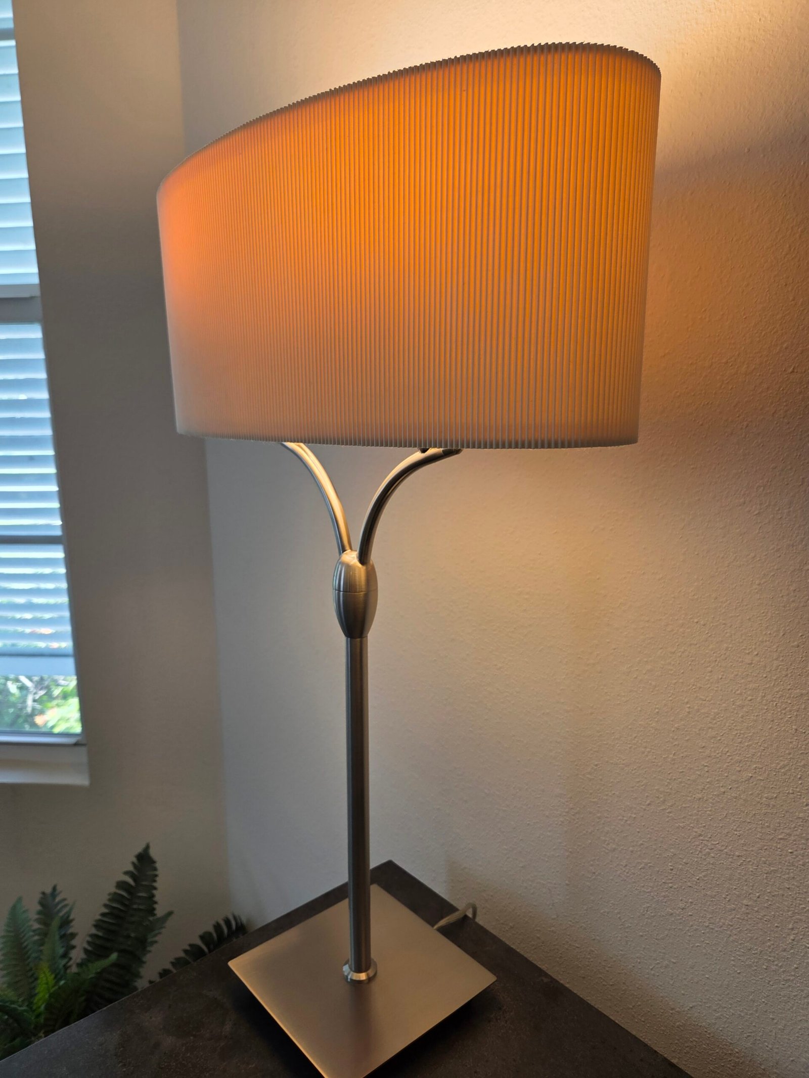 Elegant contemporary table lamp featuring a sleek brushed-metal finish - Image 2